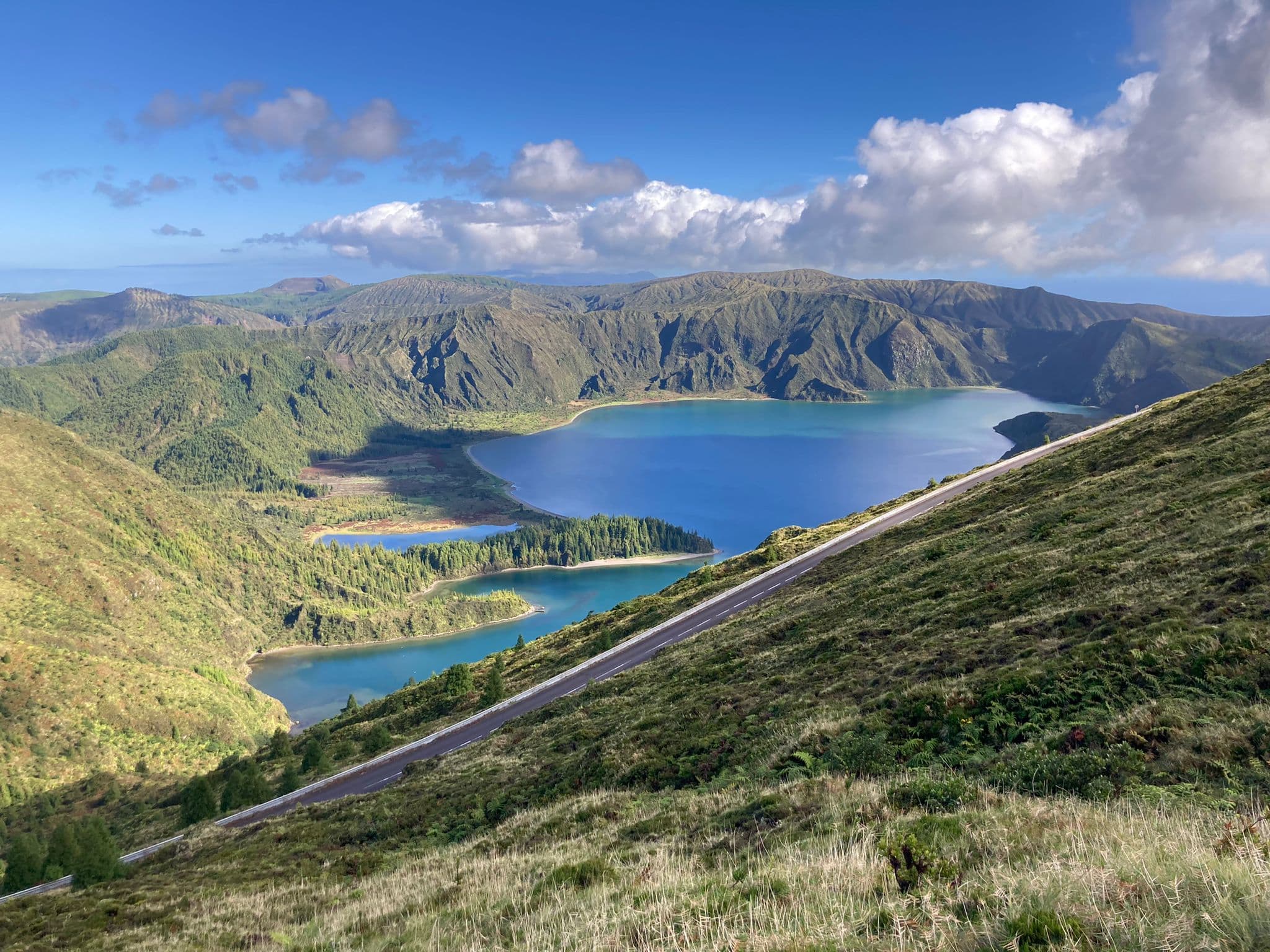 Lagoa do Fogo crater lake surrounded by green ridges